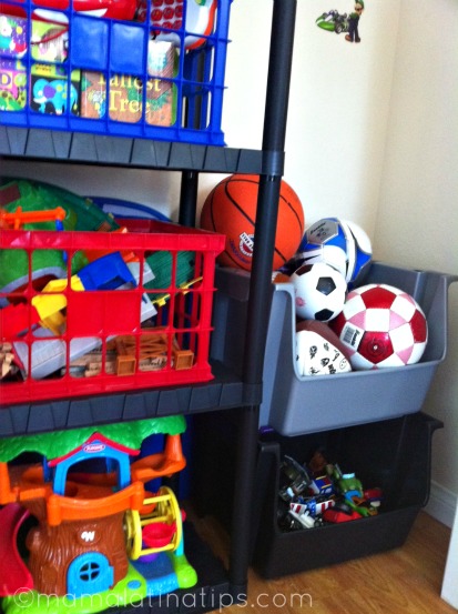A closeup of the toys, balls and cars inside a closet. 