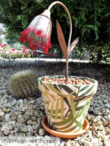 A pot covered with fabric with a solar light