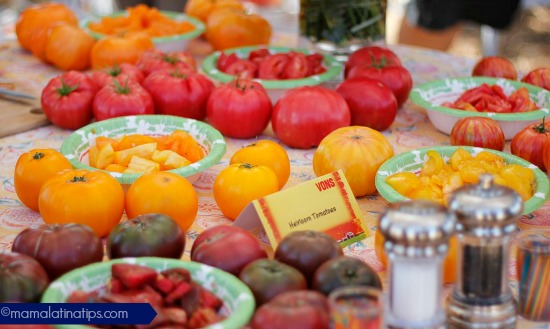 A table with different heirloom tomatoes for tasting