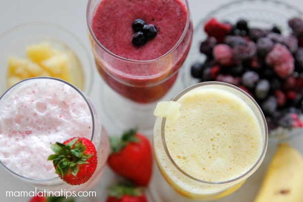 Smoothie bar with a berry smoothie, strawberry smoothie and pineapple smoothie
