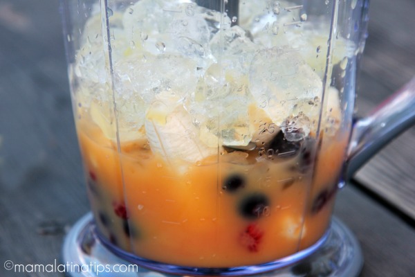 Ice, juice and fruit in a food processor