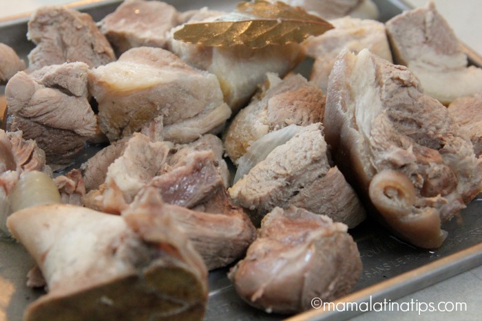 Cooked pork pieces on a baking sheet. 