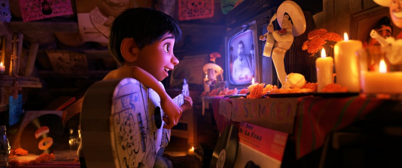 Scene of Coco, Miguel and his guitar watching his idol Ernesto de la Cruz - mamalatinatips.com