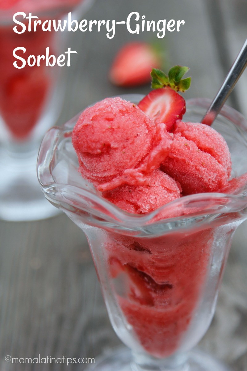Four scopes of strawberry sorbet in a glass