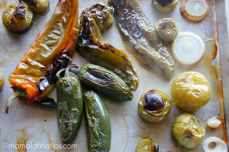 Roasted jalapeño and Ahaheim peppers, tomatillos and onion