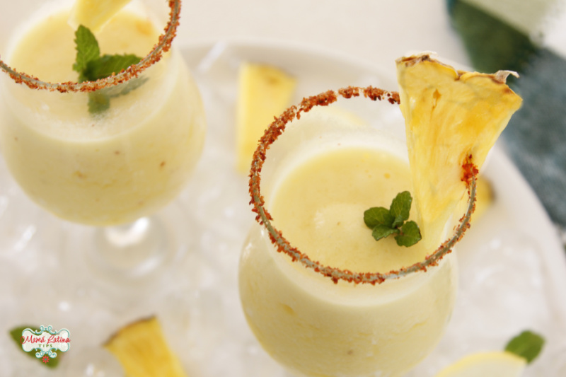 frozen pineapple margarita in two glasses