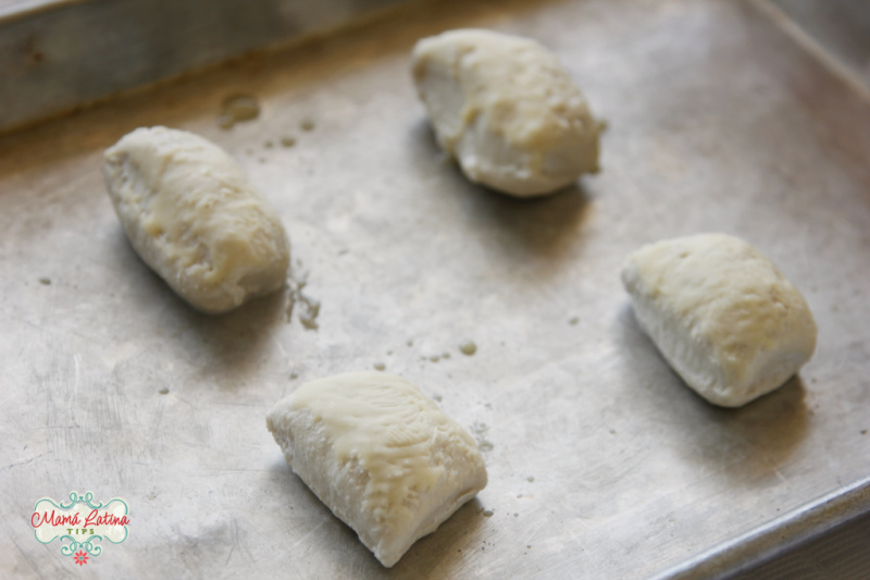 Four frozen pieces of bread roll