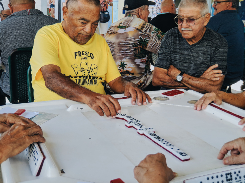 Senior citizens playing dominoes