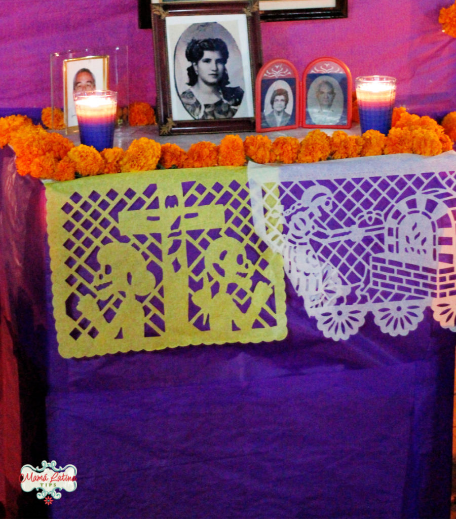 Photos on the top of a Day of the Dead altar