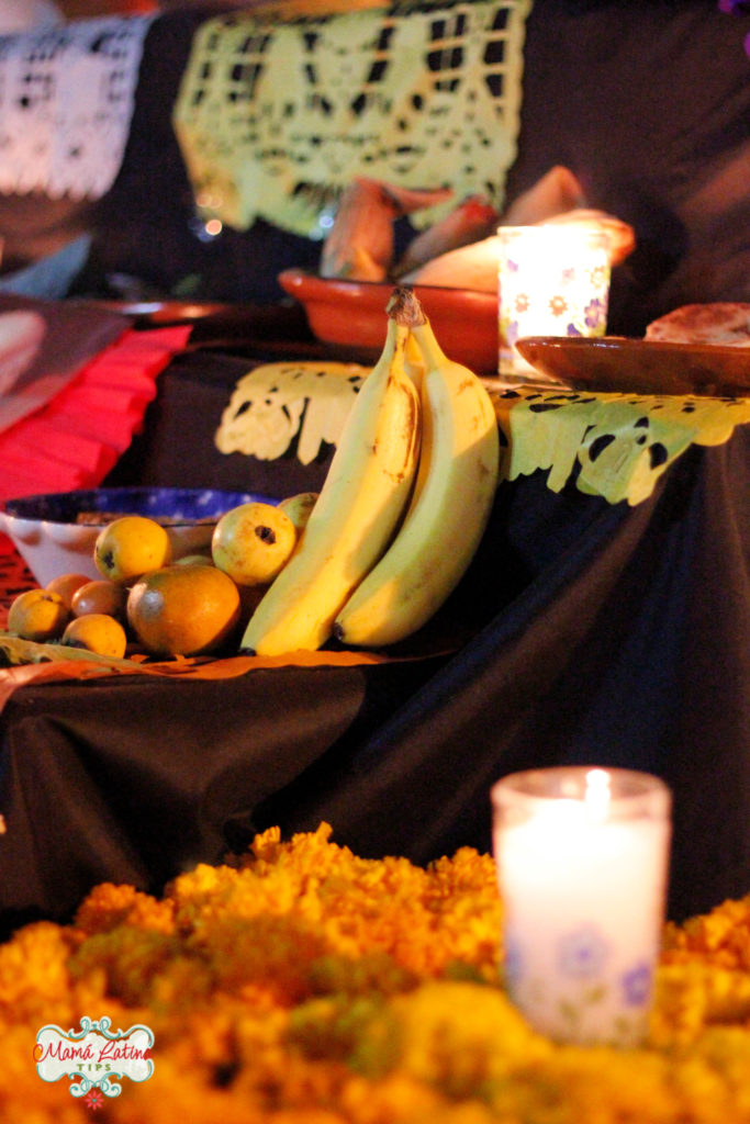 Bananas, mango and guava on top of a Day of the Dead Altar