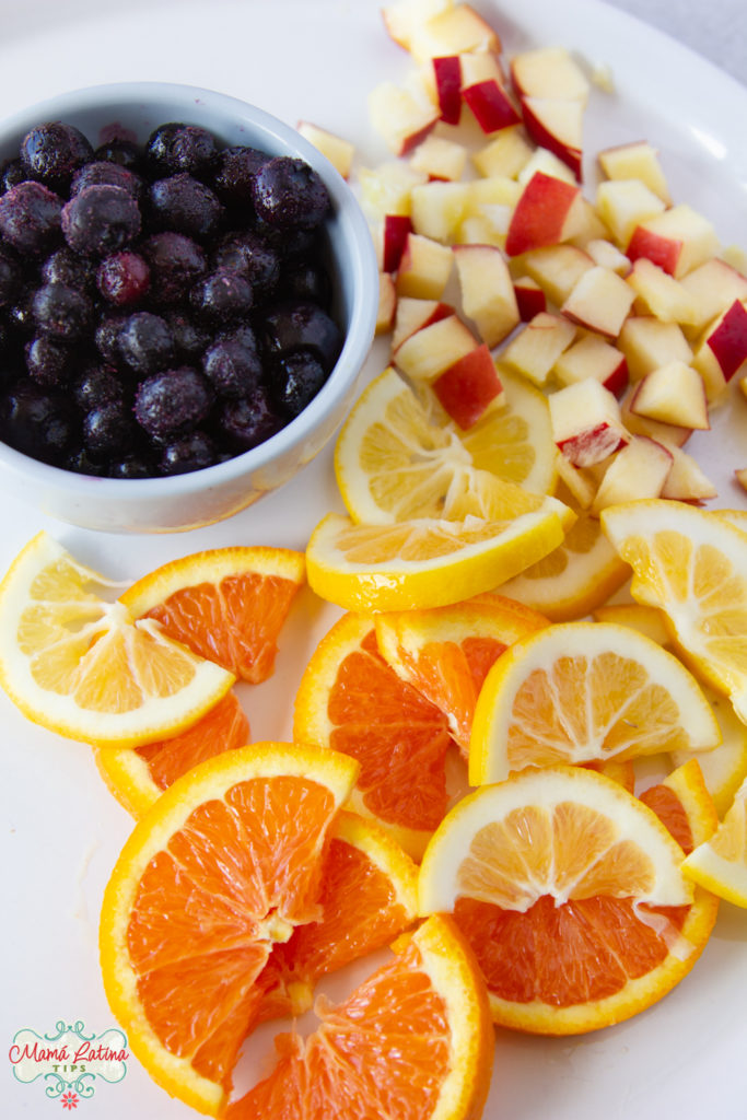 blueberries, chopped apples, sliced lemons and sliced oranges