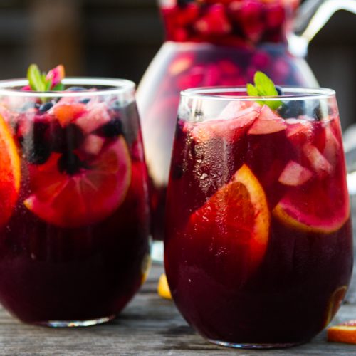 pomegranate-blueberry sangría mocktail in two glasses