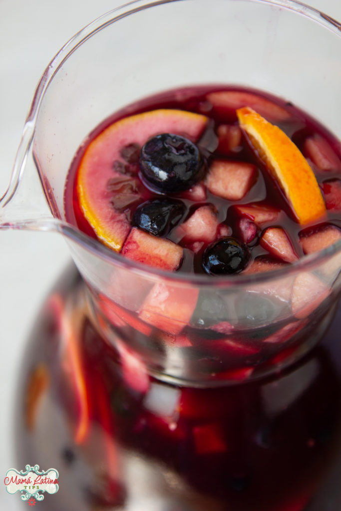 pitcher with sangría, blueberries and citrus