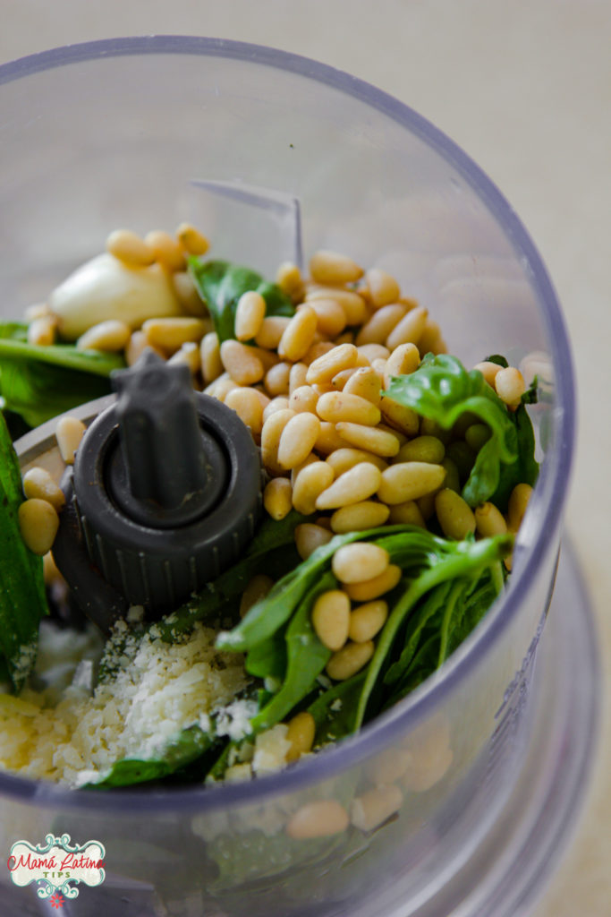 Pine nuts, garlic, and cheese in a food processor