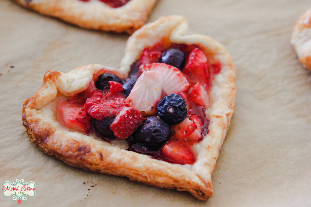 heart shaped tart with blueberries and stawberries