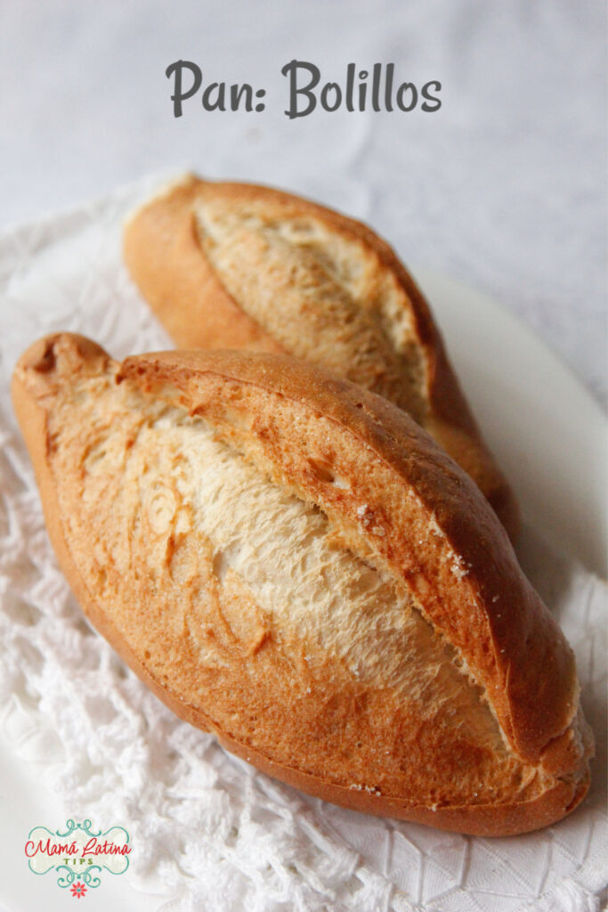 two bolillo bread on top of a white table