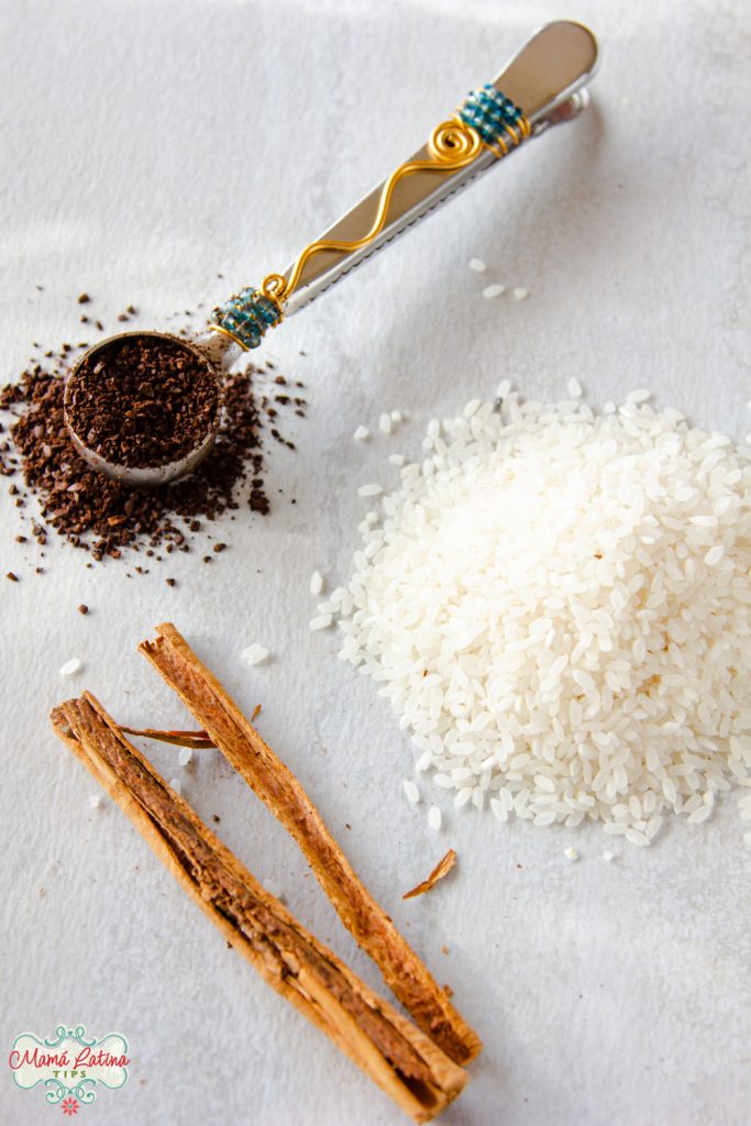 Ground coffee, rice and a broken cinnamon stick