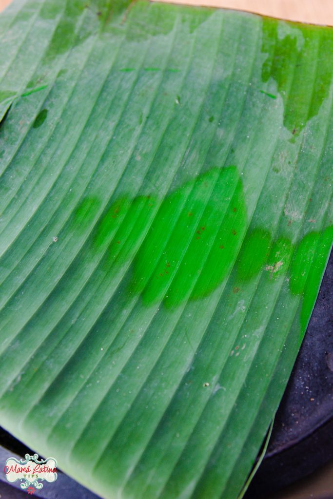 Banana leaf heating on top of a comal