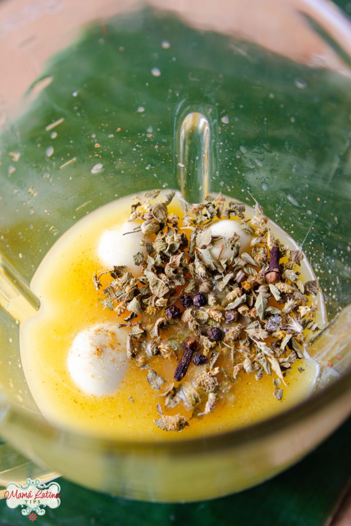 orange juice, garlic and spices in a blender