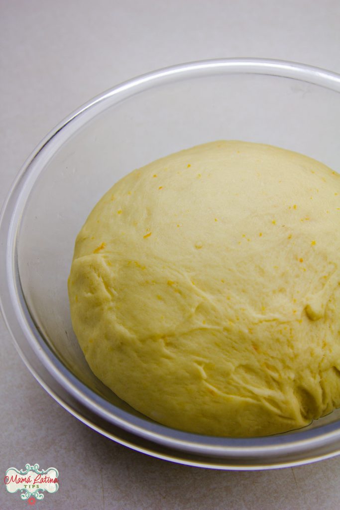 A ball of dough in a glass bowl 