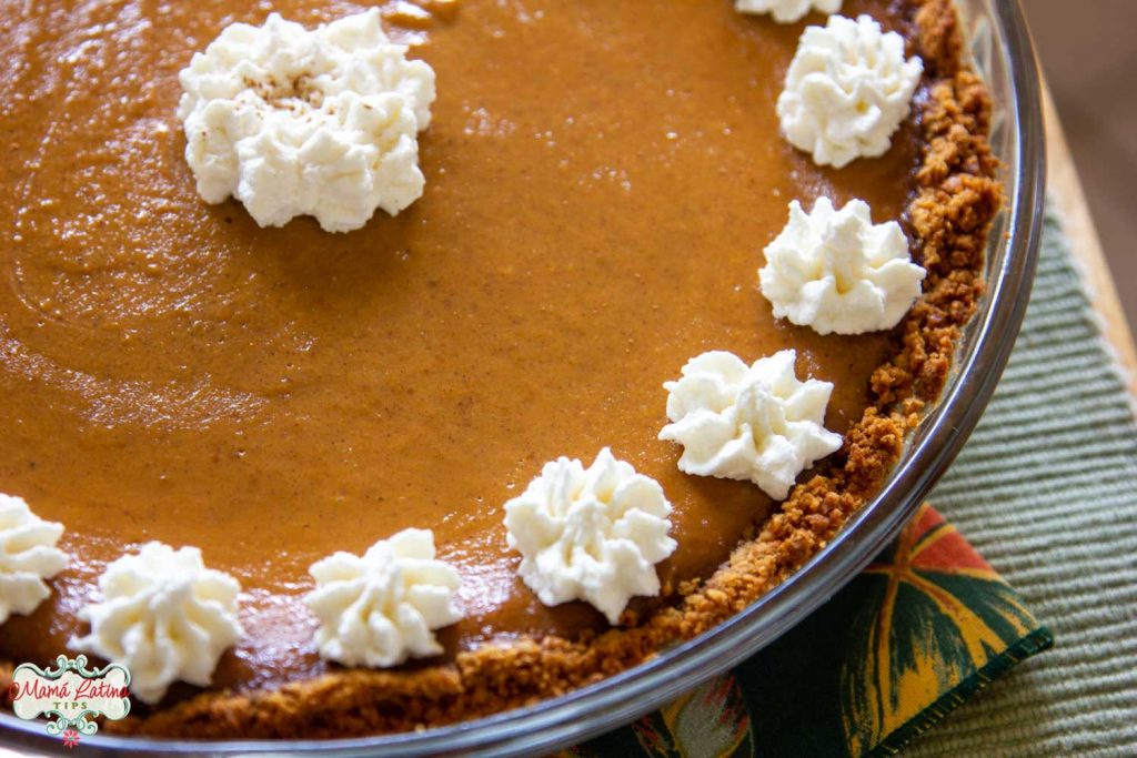pumpkin pie with cookie crust and whipped cream