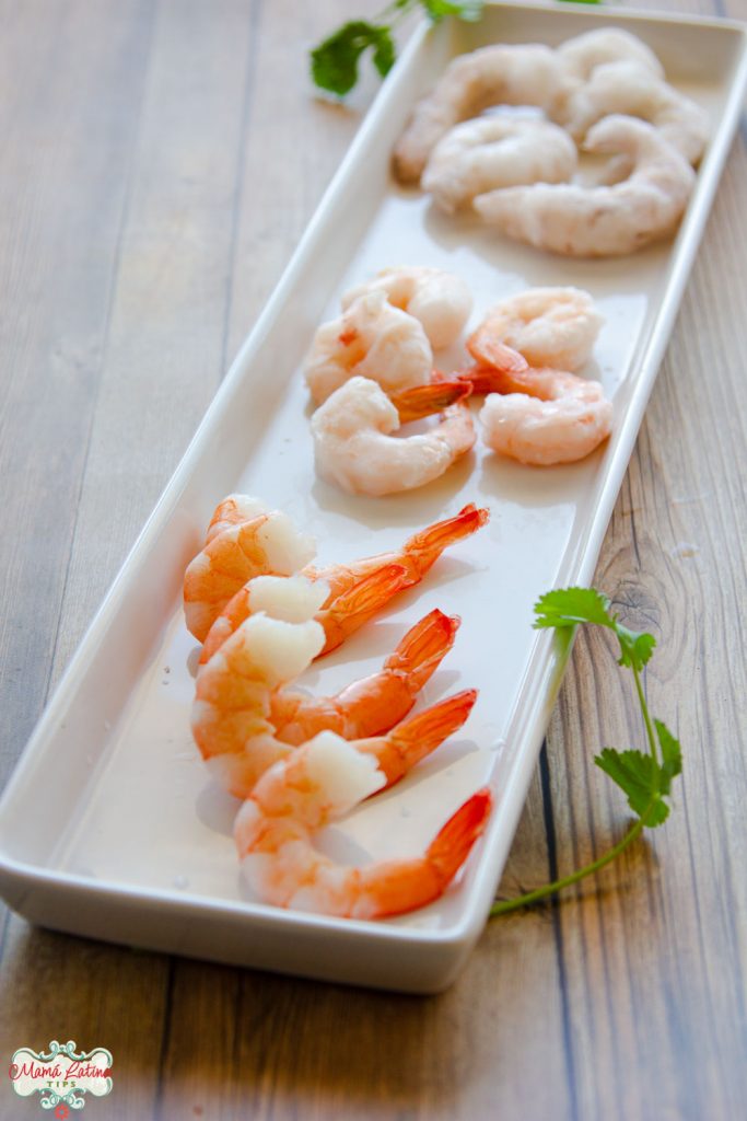 three types of shrimp on top of a rectangular plate