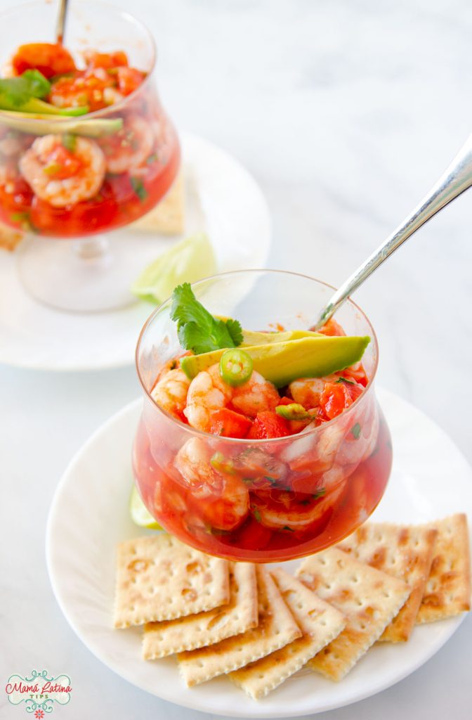 Mexican shrimp cocktail in a glass with saltines at the side