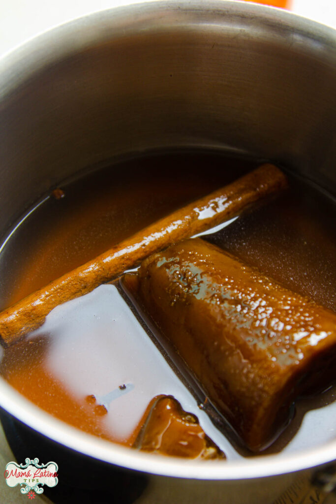 Piloncillo and cinnamon syrup in a saucepan