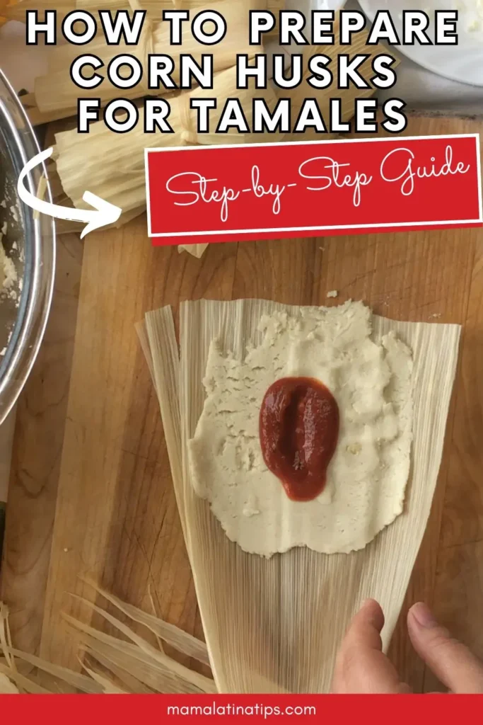 A hand spreading masa and red sauce on a corn husk, with text overlay: "How to prepare corn husks for tamales. Step-by-step guide." Perfect for anyone wanting to master homemade tamales.